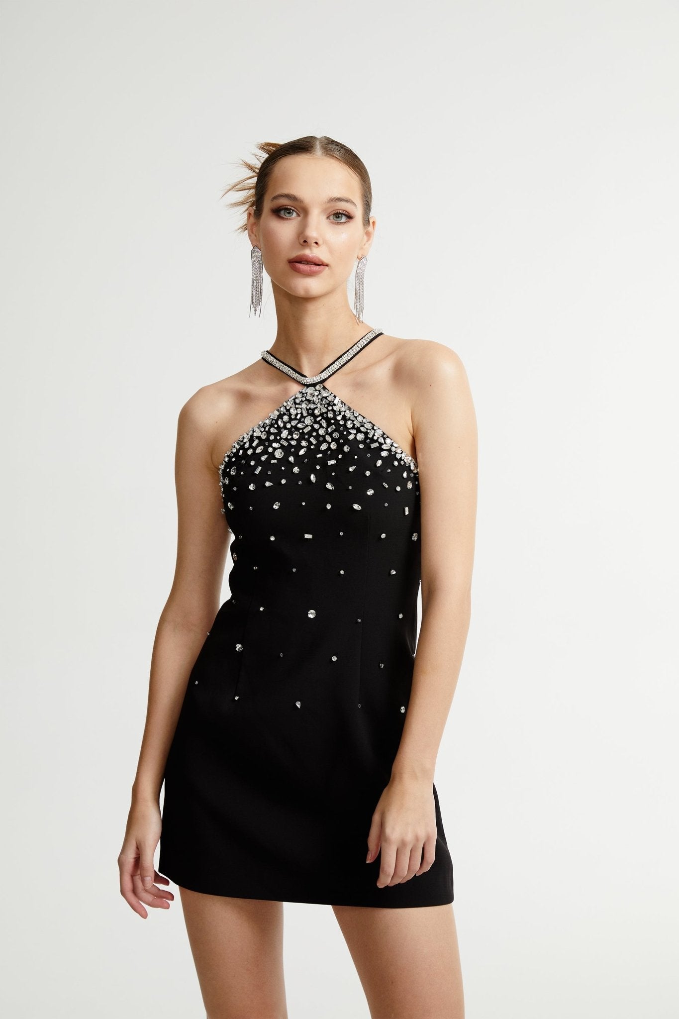 Black halter mini dress embellished with crystals on the neckline and bodice
