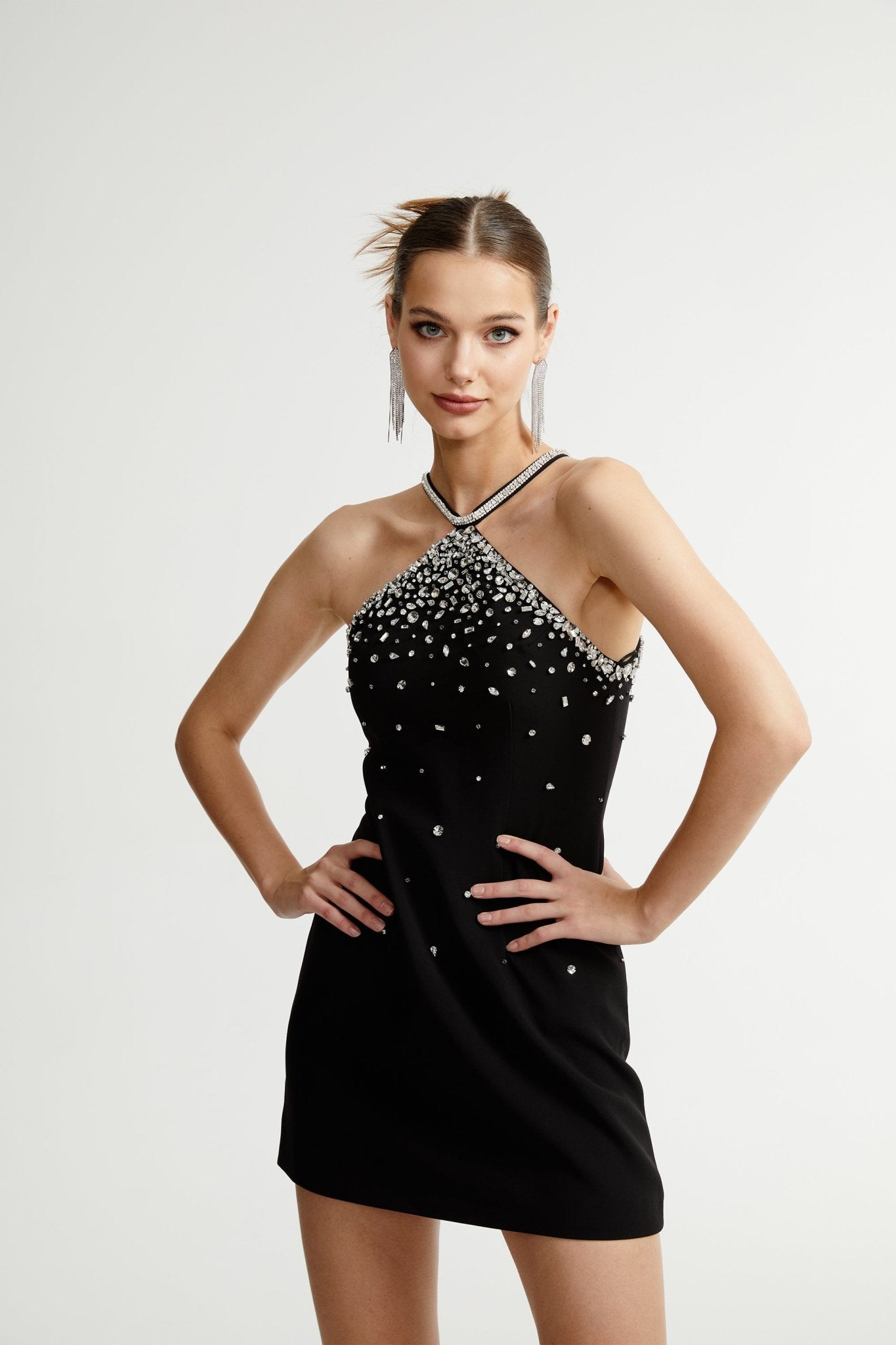 Black halter mini dress embellished with crystals on the neckline and bodice
